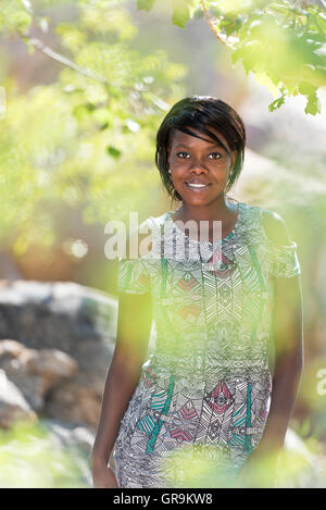 Young Pretty Woman Posing In Nature Stock Photo