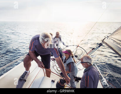 Retired friends sailing on sunny ocean Stock Photo