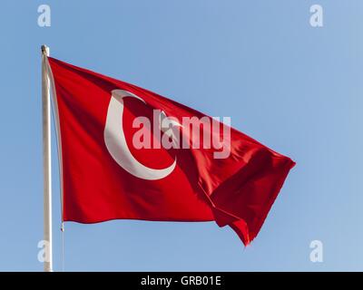 The Turkish Flag Fluttering In The Wind Stock Photo