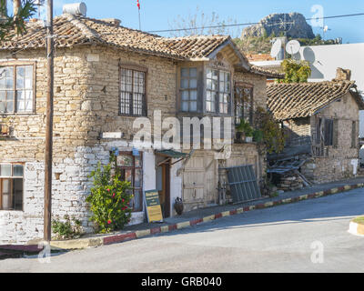 House And Business For Olive Products In Historical Style With Typical Wooden Porch In Tasagil