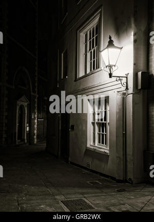 Medieval alleyway at night in the City of London Stock Photo