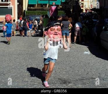 People parade through La Granja de San Ildefonso during a festival, in Spain August 21, 2016.  Copyright photograph John Voos Stock Photo