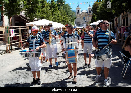 A band parades through La Granja de San Ildefonso during a festival, in Spain August 21, 2016.  Copyright photograph John Voos Stock Photo