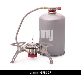 Portable gas bottle. A small compact travel bottle with a burner for  cooking on a hike. The road gas stove is filled with propane. Red tank  Stock Photo - Alamy
