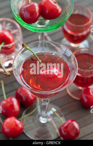 Cherry liquor in little glasses Stock Photo