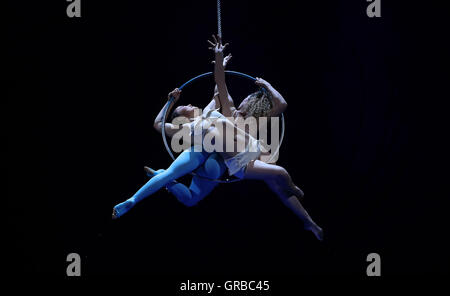 Artists perform on stage during a dress rehersal for Cirque Du Soleil's Amaluna prior to its opening on Wednesday in the big top at Manchester's Trafford Centre. Stock Photo