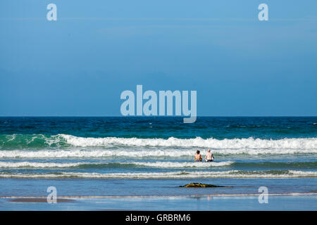 Body boarding on Druidstone Beach in Pembrokeshire Stock Photo