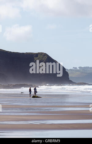 Body boarding on Druidstone Beach in Pembrokeshire Stock Photo