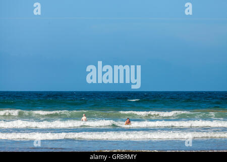 Body boarding on Druidstone Beach in Pembrokeshire Stock Photo