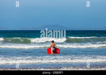 Body boarding on Druidstone Beach in Pembrokeshire Stock Photo