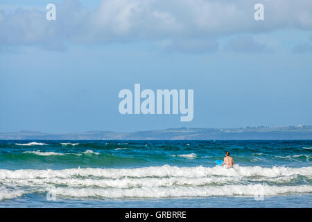 Body boarding on Druidstone Beach in Pembrokeshire Stock Photo