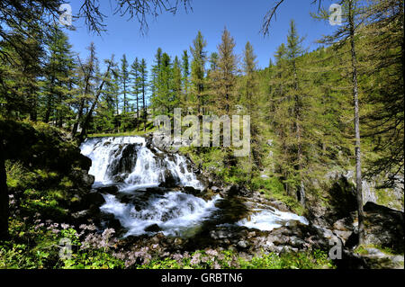 Dreamy waterfall Fontcouverte in the valley of the river Clarée; front ...