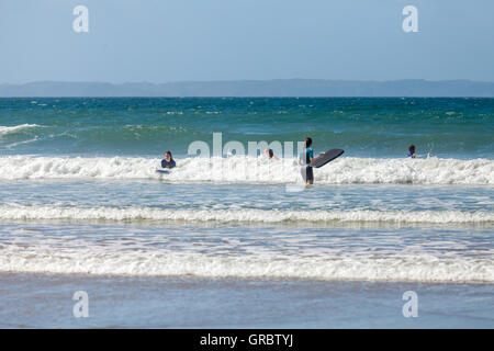 Body boarding on Druidstone Beach in Pembrokeshire Stock Photo