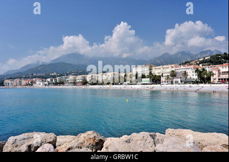 Panoramic View Of The Coastline Seen From Menton, French Riviera With Hotels And Beaches In The Scenery Of The Mountains Of Maritime Alps, French Alps, France Stock Photo