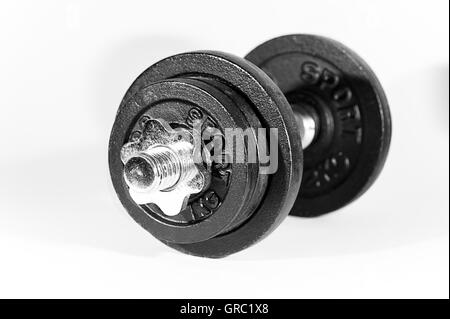 Chrome Dumbbell With Black Weights On A White Background Stock Photo
