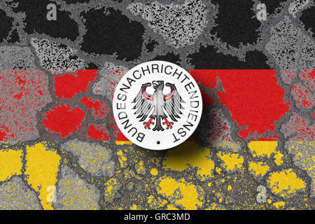 Eroding German Flag With Sign Of Bundesnachrichtendienst On A Bad Road Stock Photo