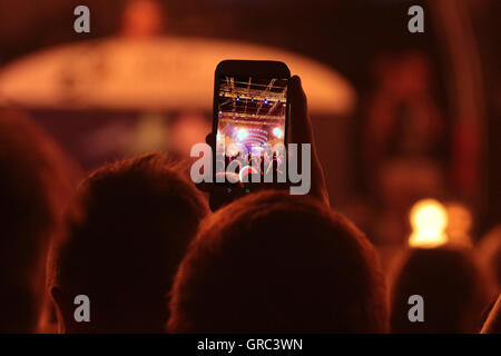 Filming A Music Gig With A Cell Phone Stock Photo - Alamy