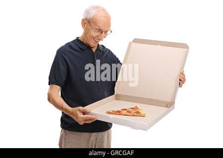 Happy senior looking at a pizza box with a single slice of pizza inside isolated on white background Stock Photo
