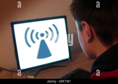 Teenager Surfing On The Web Using Wireless Fidelity Network Stock Photo