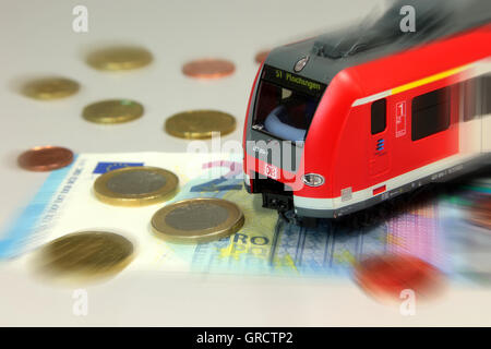 Railway Ticket Fares Increase Regional Commuter Train With Euro Bills And Coin Stock Photo