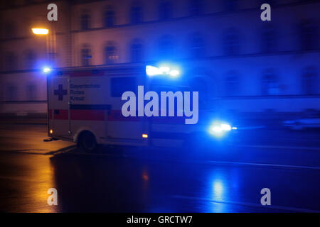 Bavarian Red Cross Ambulance Car In Operation In Munich Stock Photo