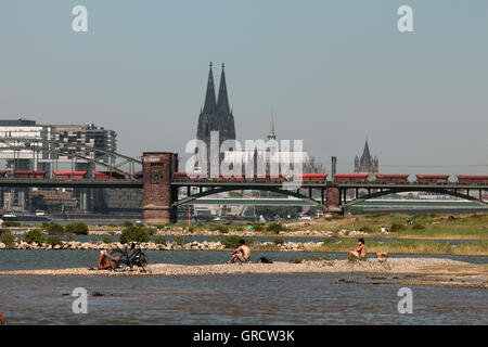 Hot Summer Day At Rhine Shore With Cologne Cathedral Stock Photo