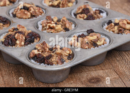 Walnut raisin muffins in an old fashion muffin pan Stock Photo