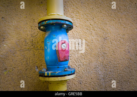 The valve on the gas pipe with a broken stick Stock Photo