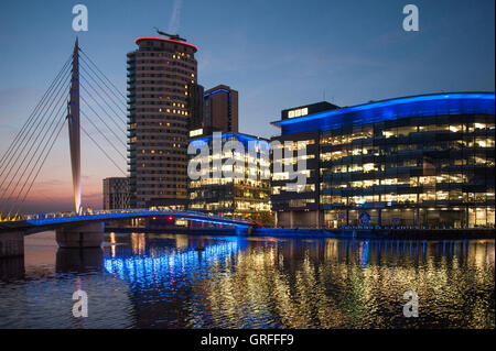 Media City BBC offices lit up at sunset - Salford Stock Photo