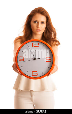 Woman showing a clock as a sign of being late isolated over white Stock Photo