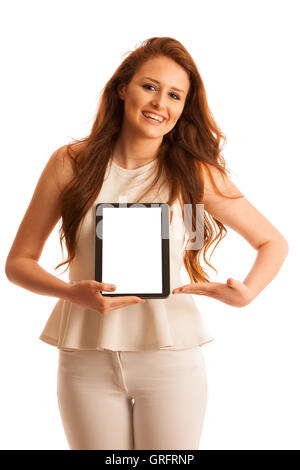 Business woman brousing the web on a tablet isolated over white background. Stock Photo