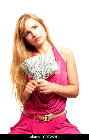 Pretty blonde woman with wad of dollars on white background Stock Photo