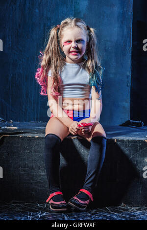 The funny crasy girl with candy on dark background Stock Photo