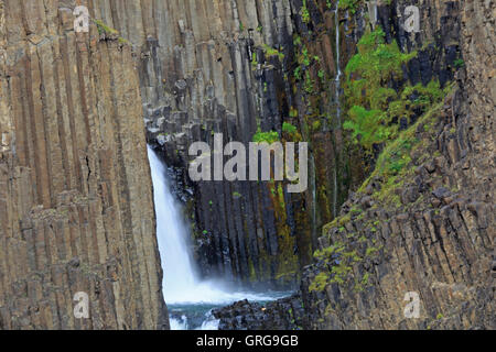 Close up view of part of Litlanesfoss waterfall showing the basalt columns Stock Photo