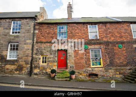 A derelict cottage in need of renovation in the village of Belford, Northumberland England UK Stock Photo