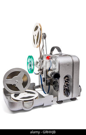 Retro old reel movie projector for cinema.  With clipping path. A reels of motion picture film on a white background. Stock Photo