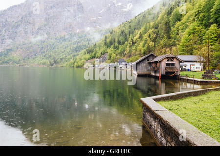 Cottages in the lake in Hallstatt a foggy and rainy day Stock Photo