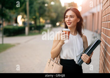 Beautiful businesswoman drinking coffee Stock Photo
