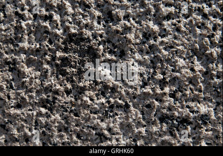 Close-up of an old granite stone rough pattern. Horizontal image. Stock Photo