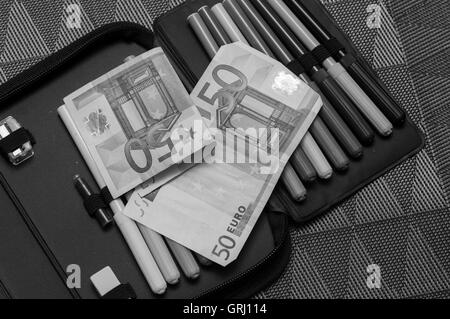 expensive school theme, pencil case with euro money Stock Photo