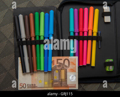 expensive school theme, pencil case with euro money Stock Photo