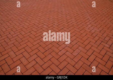 Sidewalk, paved with red tiles. Beautiful background Stock Photo