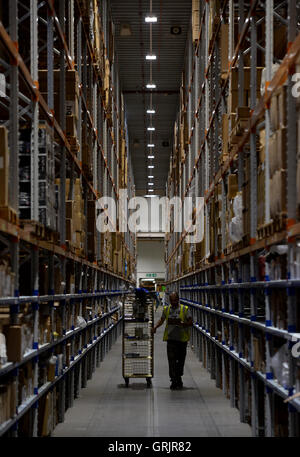 A worker in the Sports Direct warehouse in Shirebrook, Nottinghamshire, as the company held an open day coinciding with its annual general meeting. Stock Photo