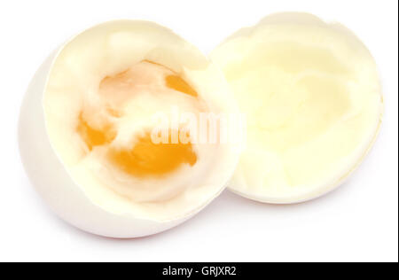 Broken boiled egg over white background Stock Photo