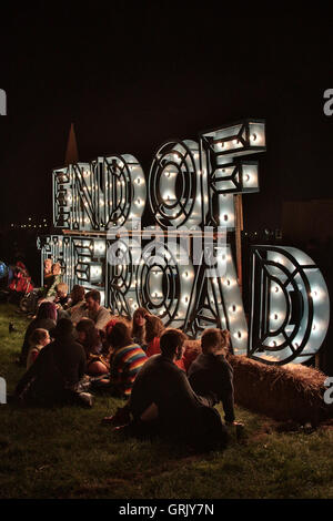 Festival goers around a sign for the End of the Road Festival on day 1 of the 2016 edition of the festival in Larmer Tree Garden Stock Photo