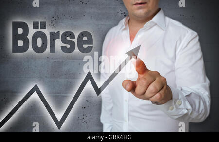 Boerse (in german stock market) touchscreen is operated by man. Stock Photo