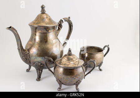 Very old silver kitchen utensils made of on white Stock Photo