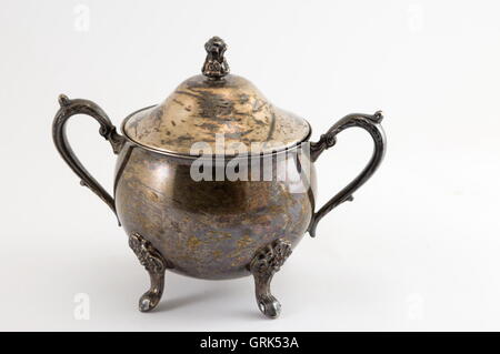 Very old silver kitchen accessories made of on white Stock Photo