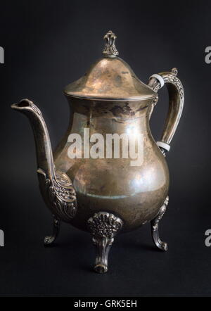 Very old kitchen accessories made of silver on black Stock Photo