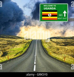 Uganda road sign against clear blue sky Stock Photo